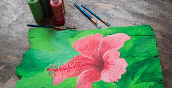 beautiful flower painted on wood plank with acrylics