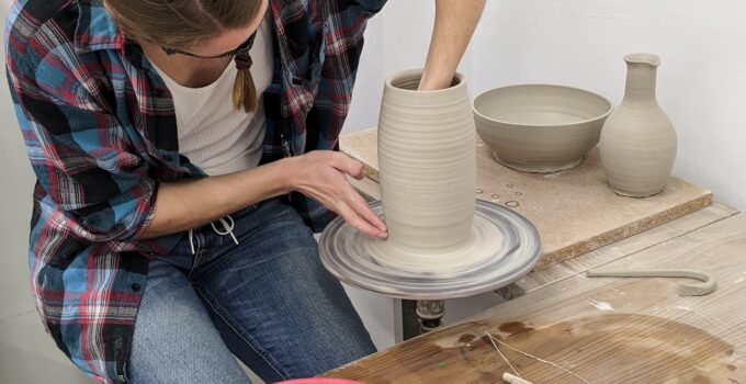 potter making pot with kick wheel