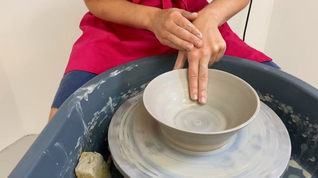 pottery on wheel with medium nails
