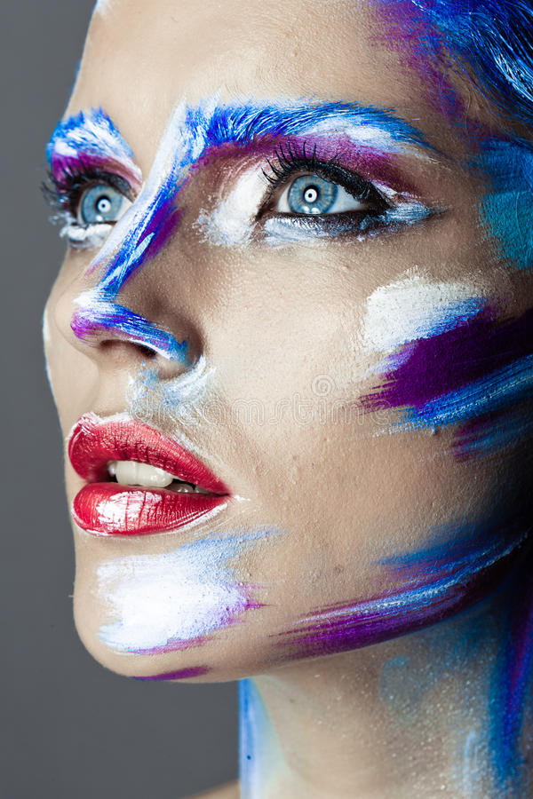 creative-art-makeup-young-girl-with acrylic on eyes