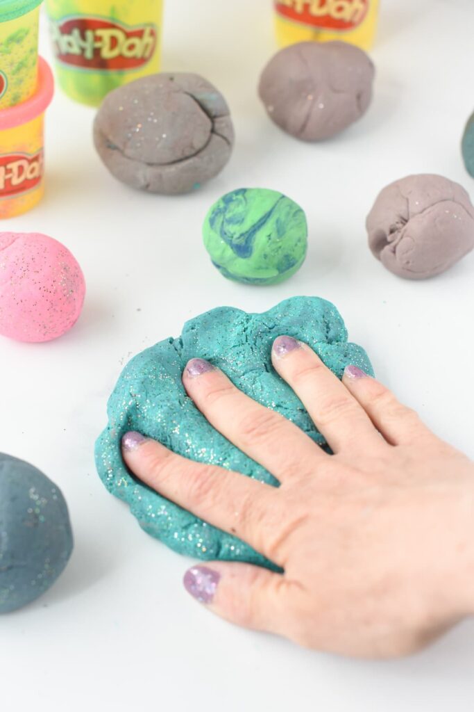kneading play doh for making it moist